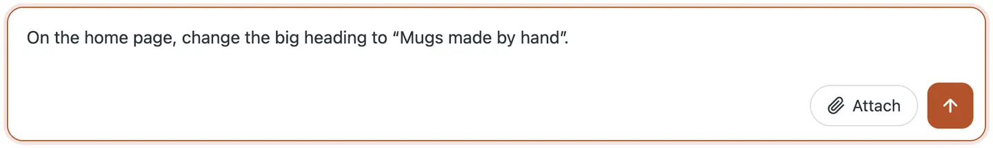 The chat box with the request typed in: on the home page, change the big heading to Mugs made by hand