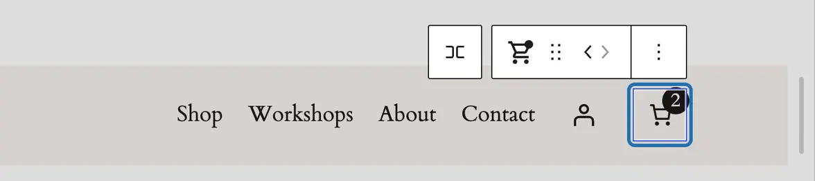 Our header in the editor: Shop, Workshops, About, Contact, an account icon, then the cart outlined, its toolbar above