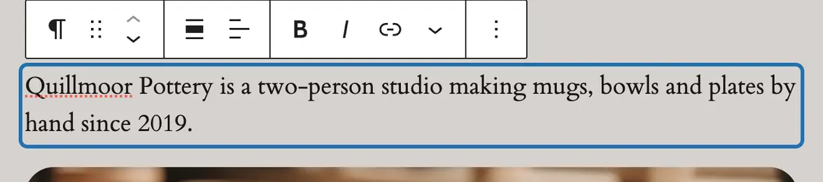 The About page's first paragraph clicked in the editor: outlined in blue, with the small toolbar above it